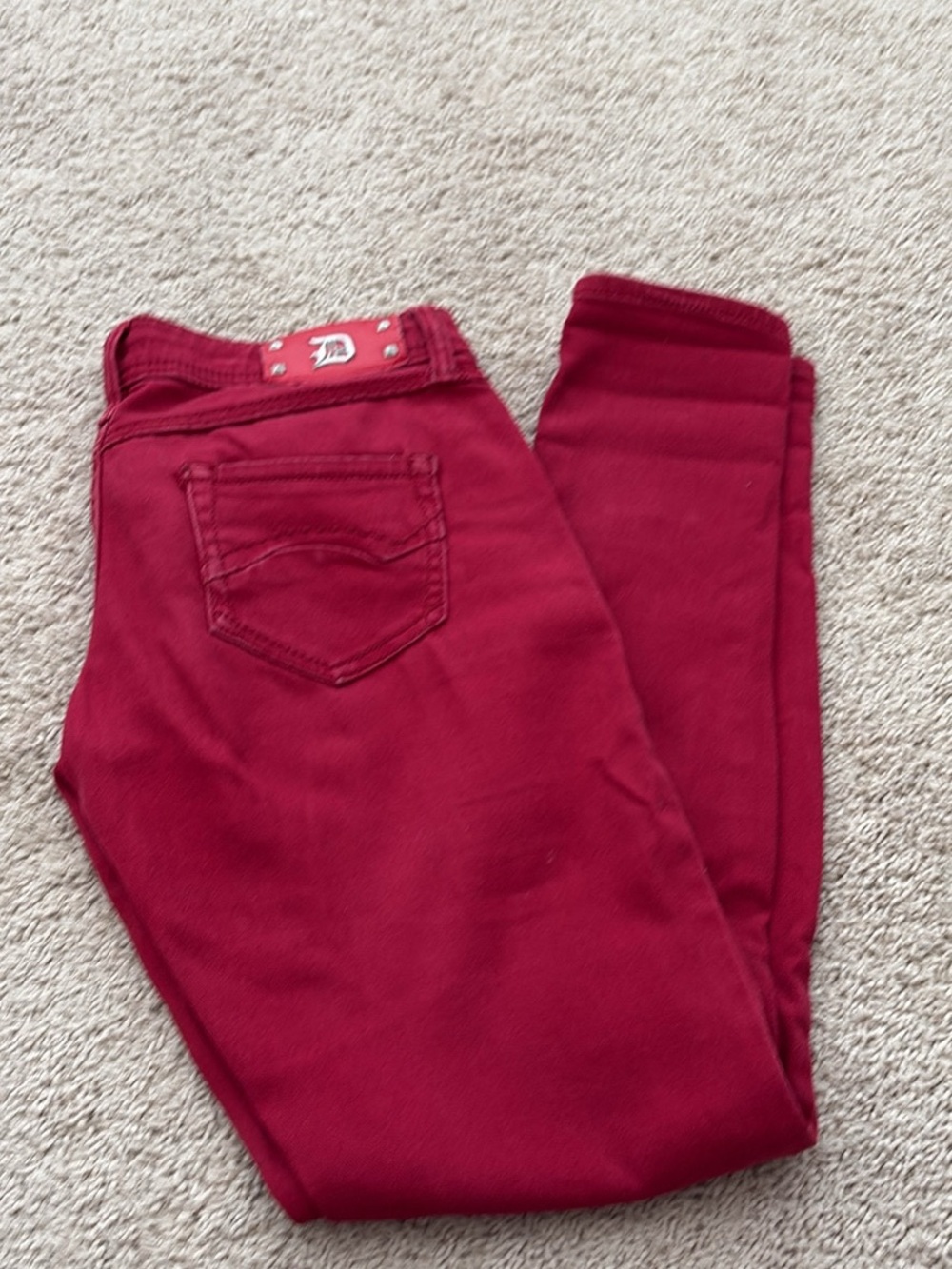 Women's Skinny Jeans in Deep Red - size 3